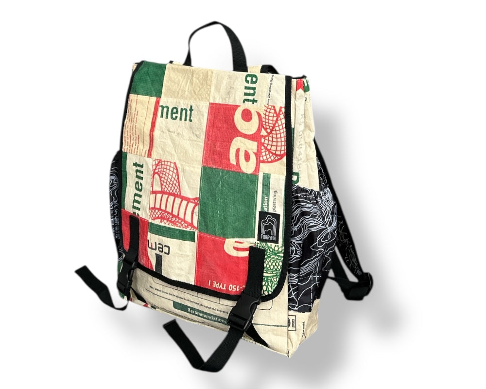 Backpack with newspaper-like pattern on a white background