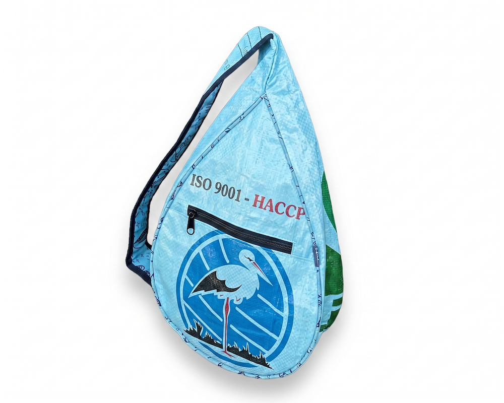 multi-compartment sustainable city sling backpack